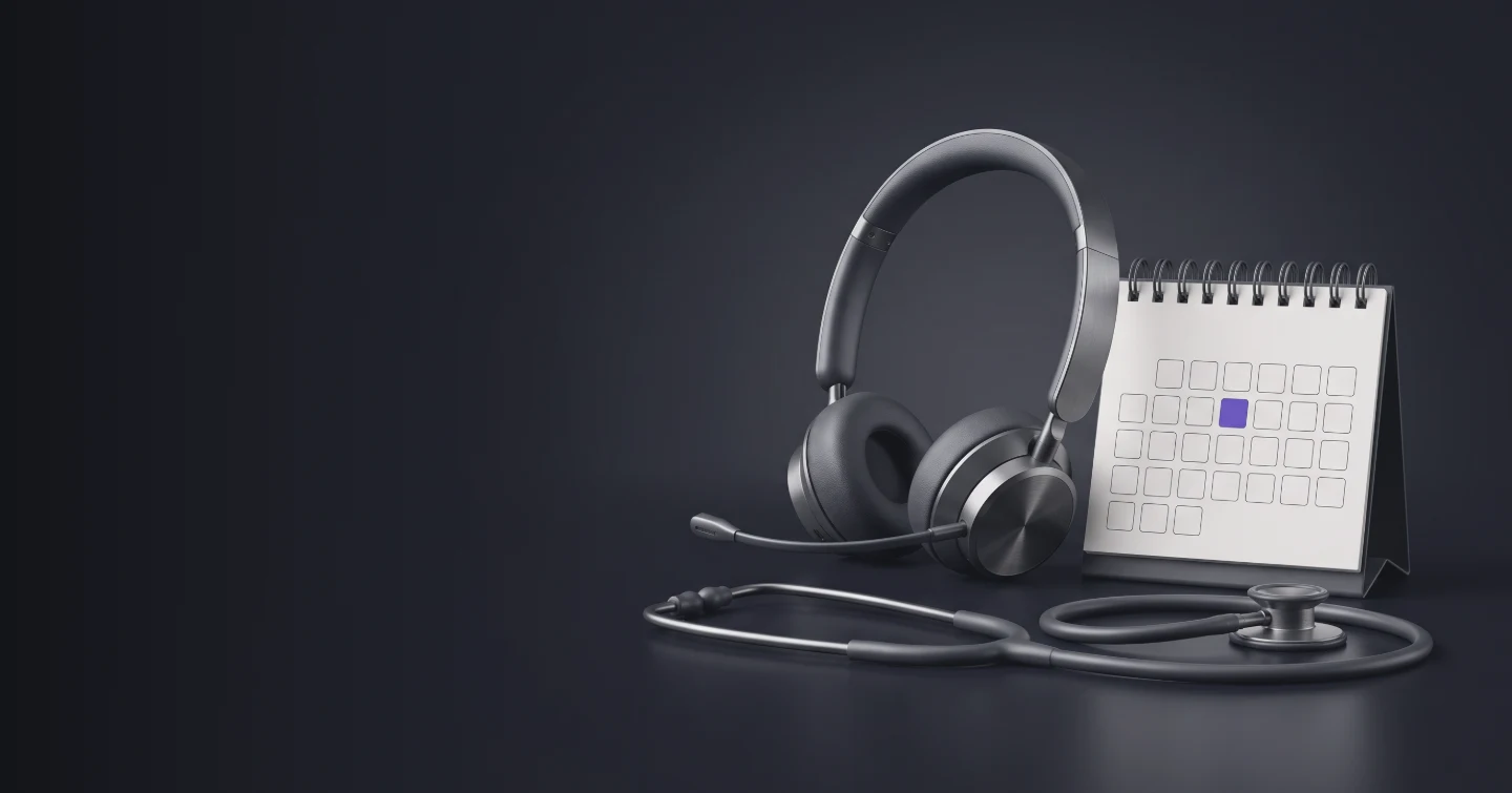 A headset beside a desk calendar with one day marked, and a stethoscope in front