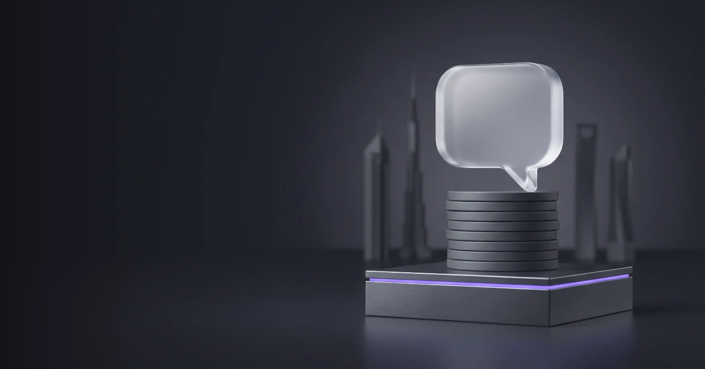 A glass chat bubble resting on a stack of coins, with a Gulf city skyline behind it